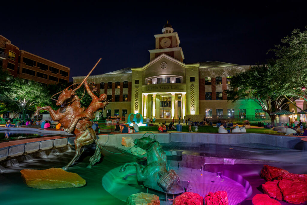 A night view of Sugar Land TX town square, where you can spend your time while receiving cleaning services Sugar Land residents!